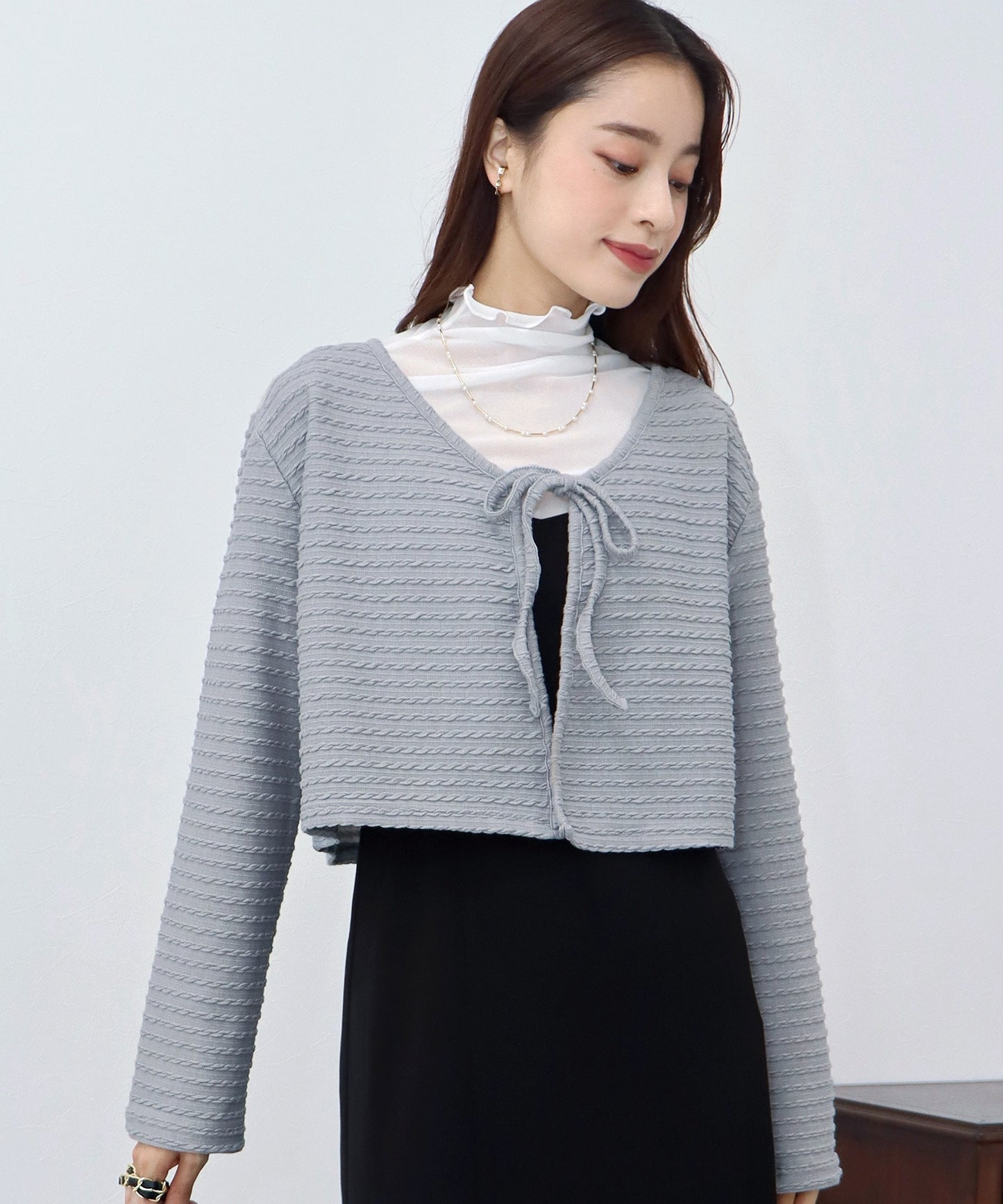 케이블 무늬 리본 가디건