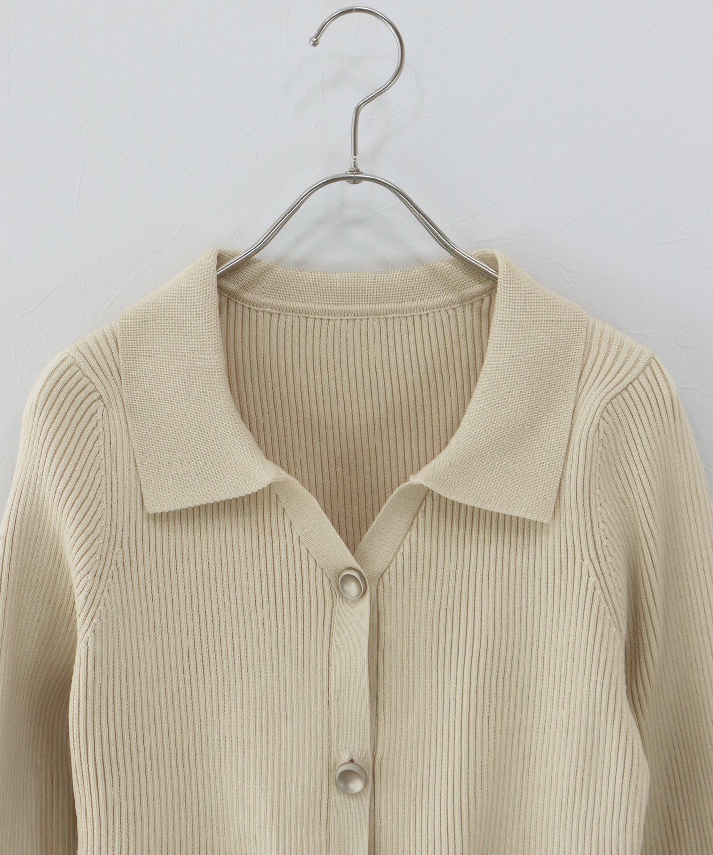 スキッパーペプラムニット