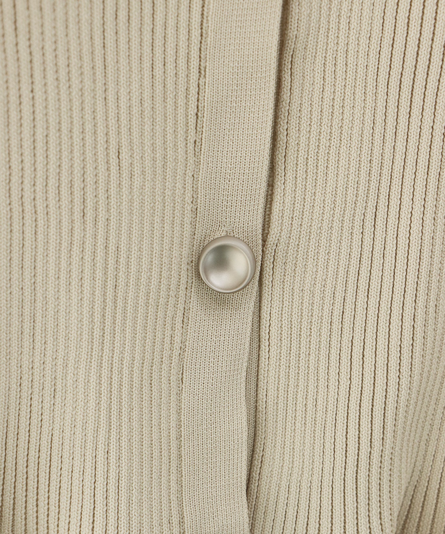 スキッパーペプラムニット