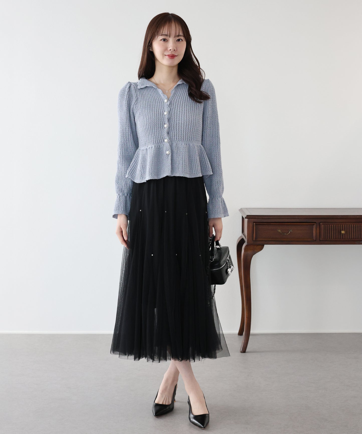 パールボタンペプラムニット