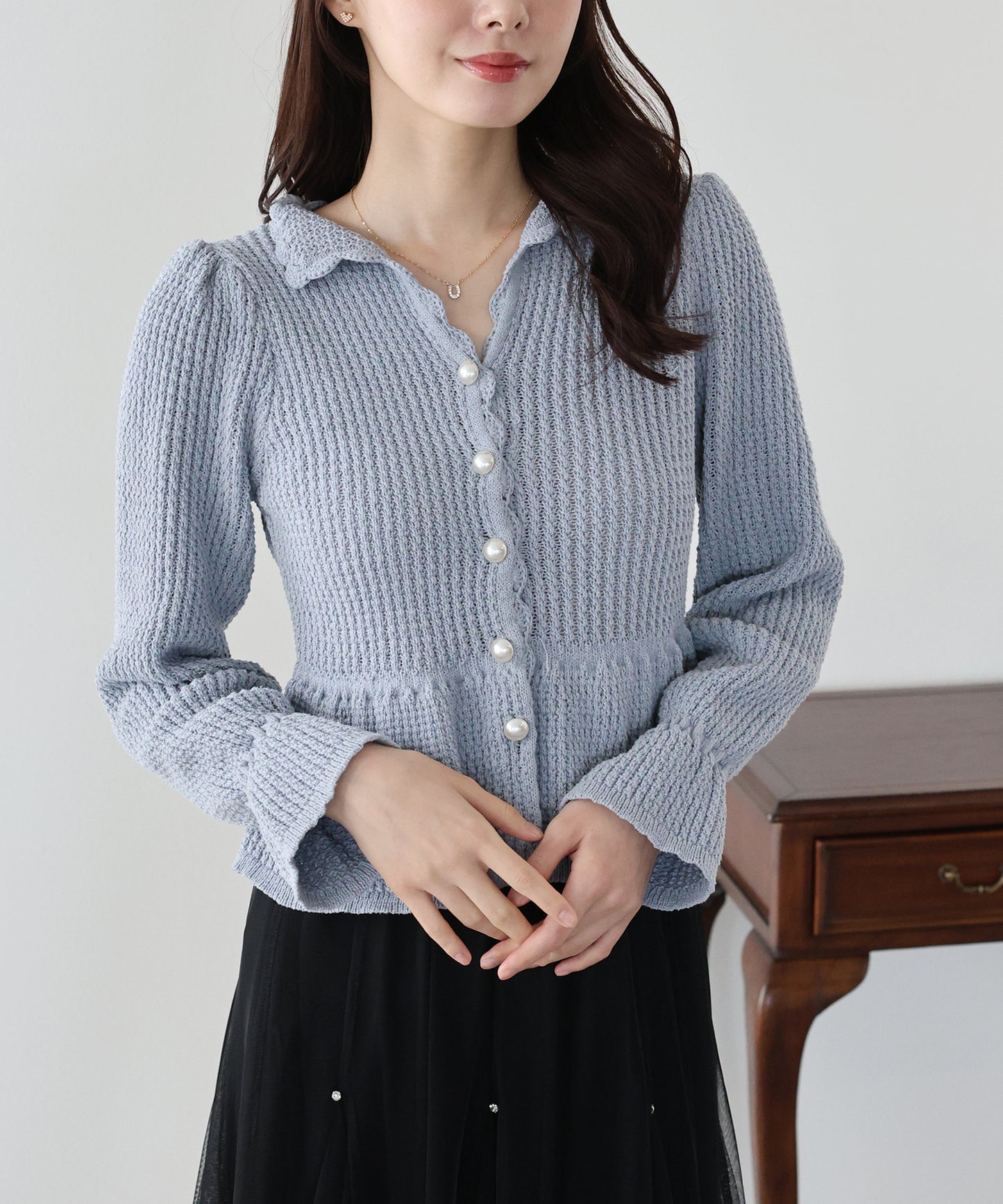 パールボタンペプラムニット