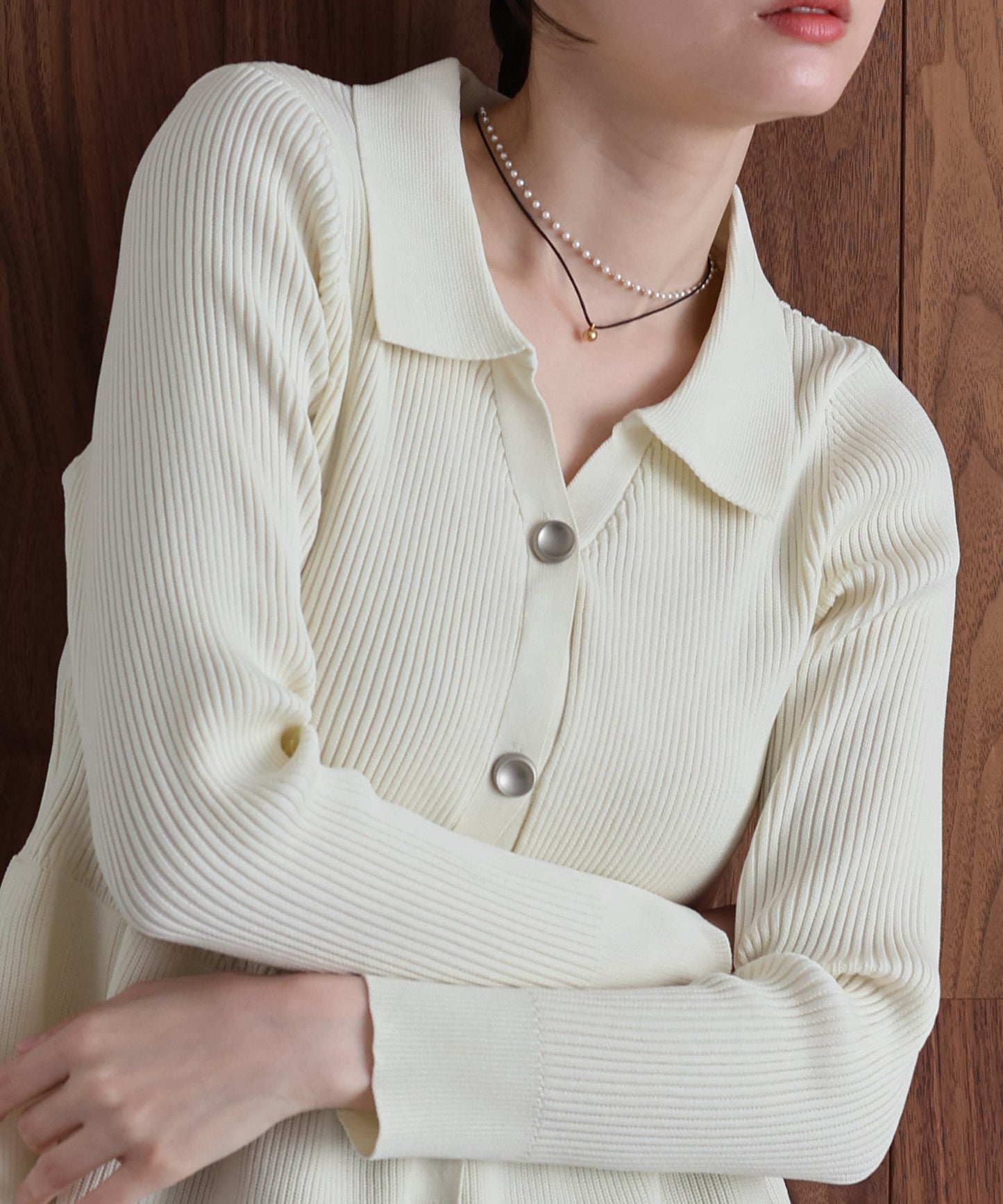 スキッパーペプラムニット