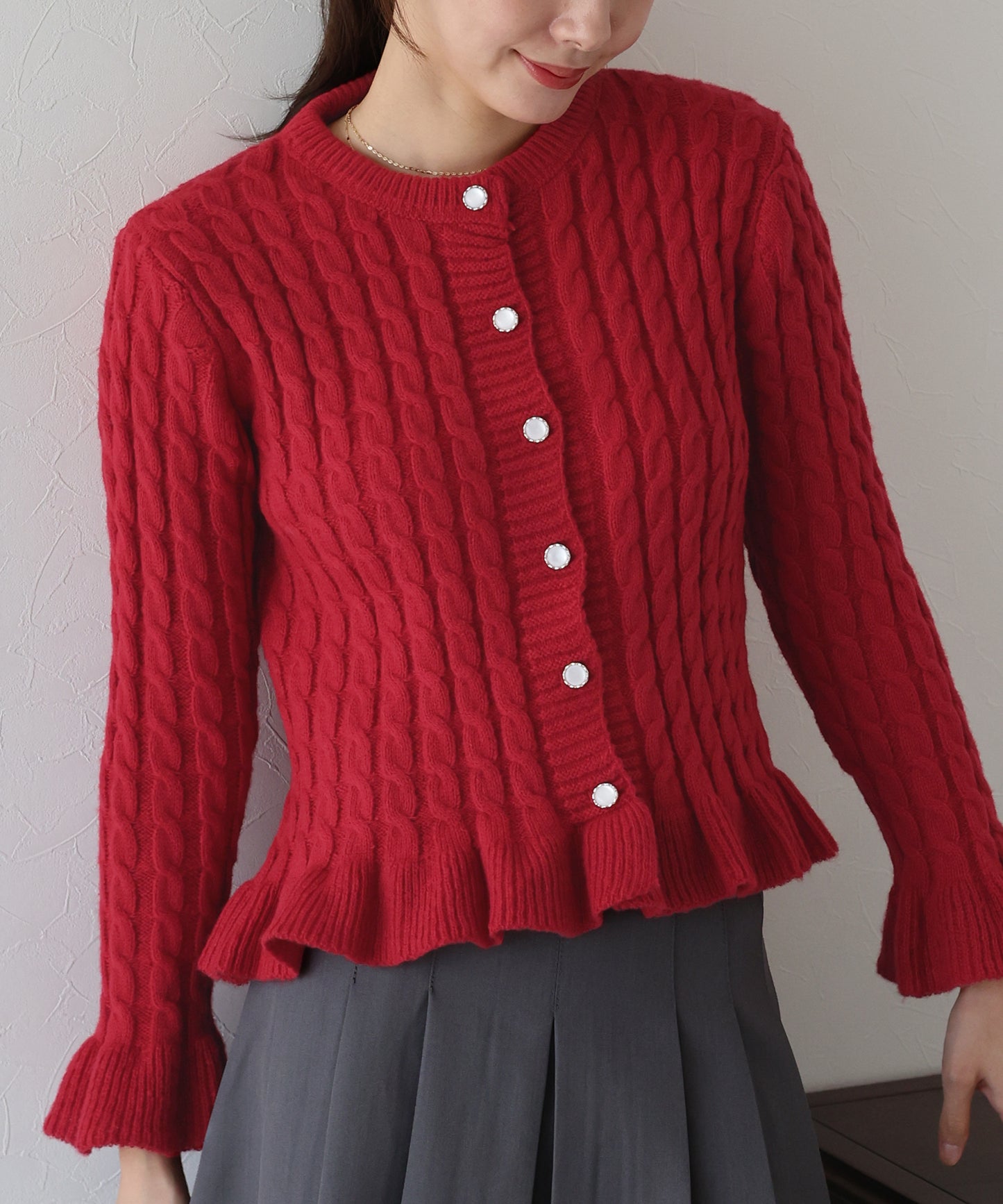 ケーブルペプラムカーディガン