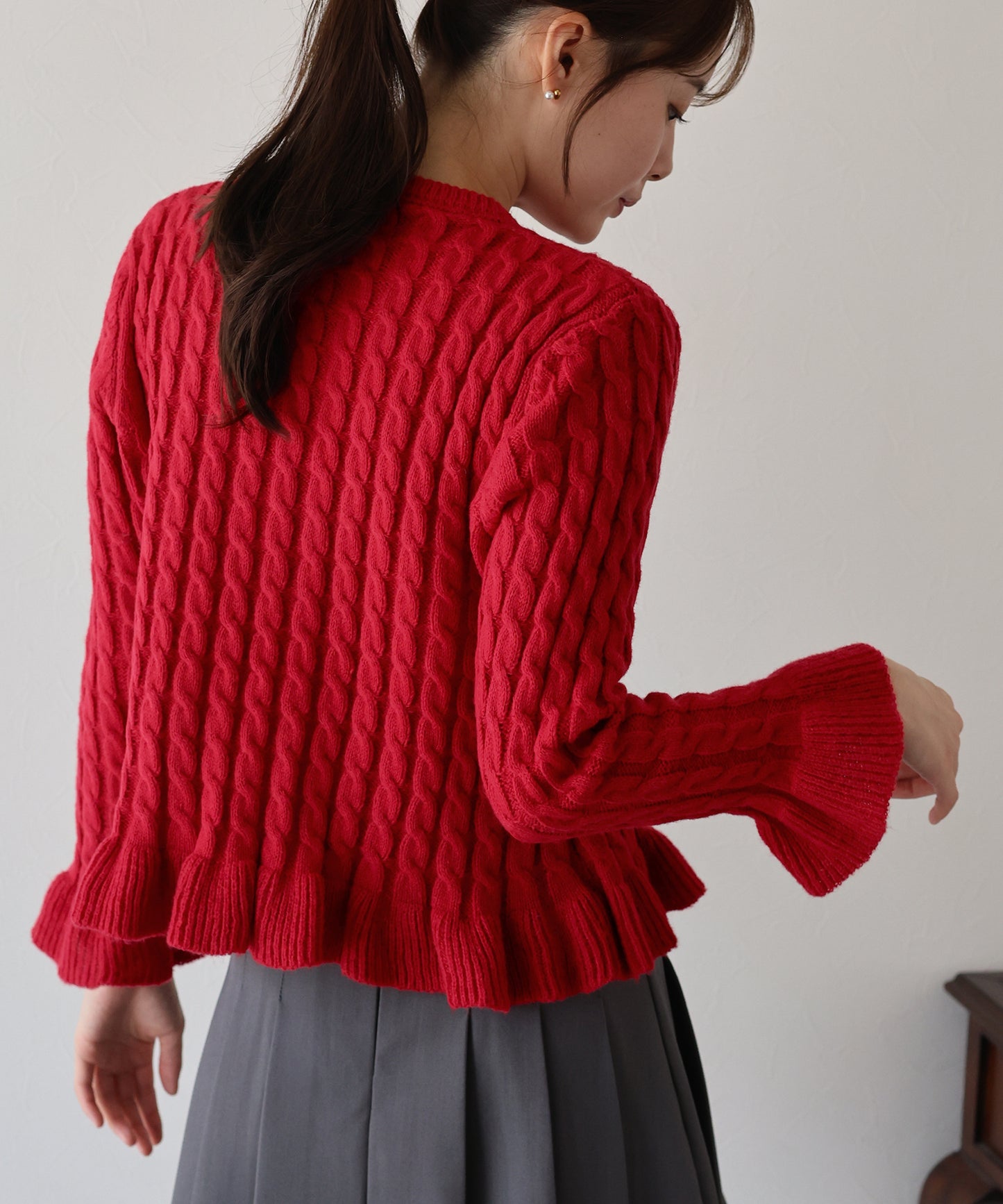 ケーブルペプラムカーディガン