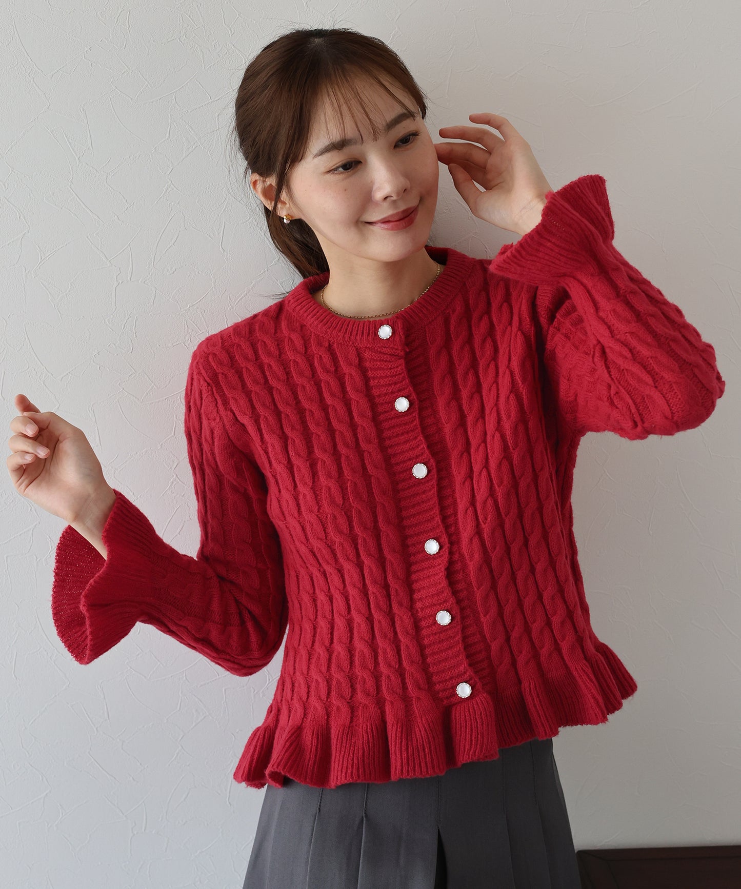 ケーブルペプラムカーディガン