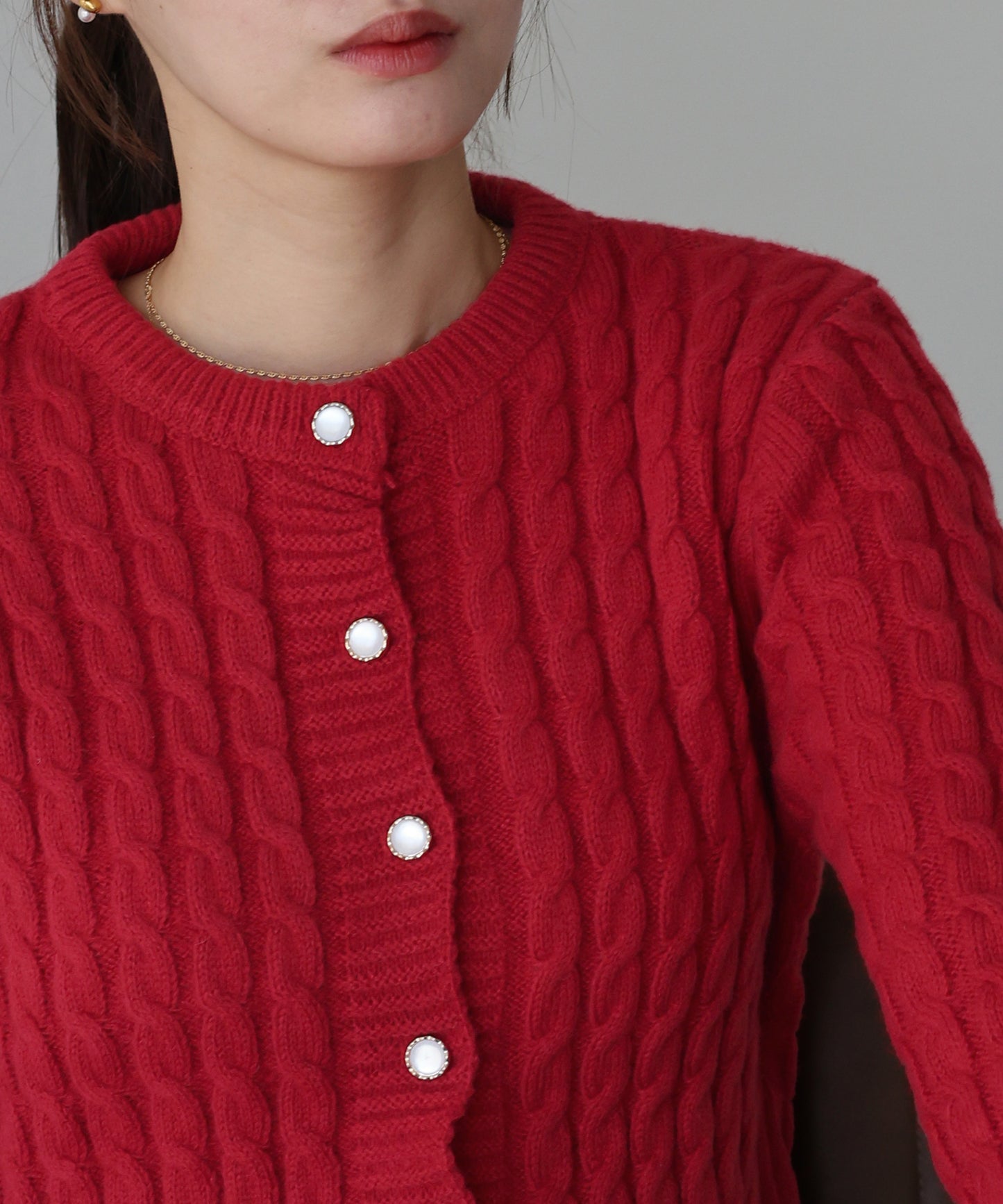 ケーブルペプラムカーディガン