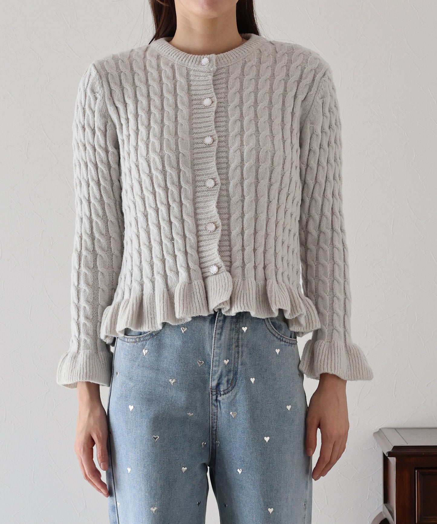 ケーブルペプラムカーディガン