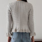 ケーブルペプラムカーディガン