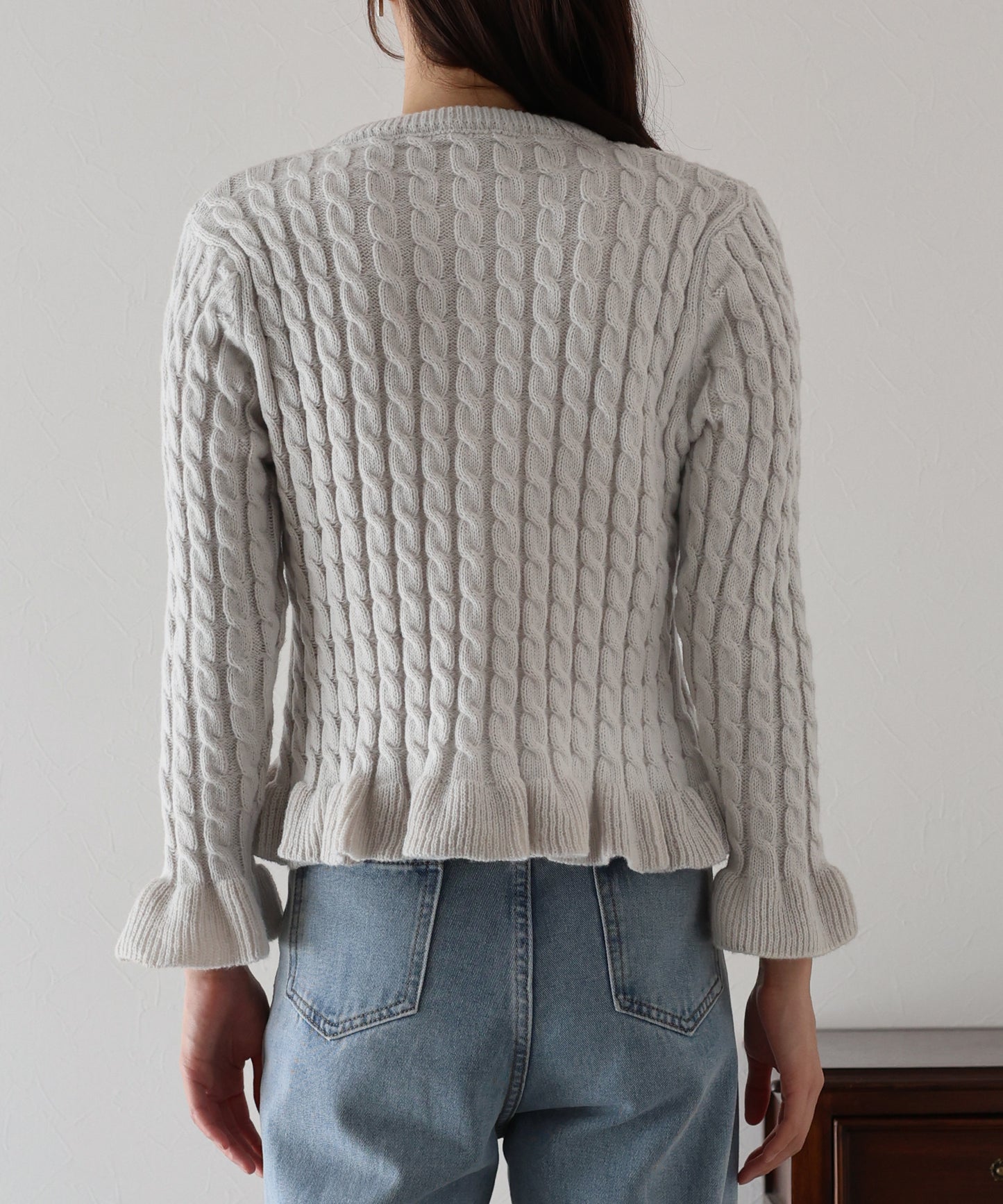 ケーブルペプラムカーディガン