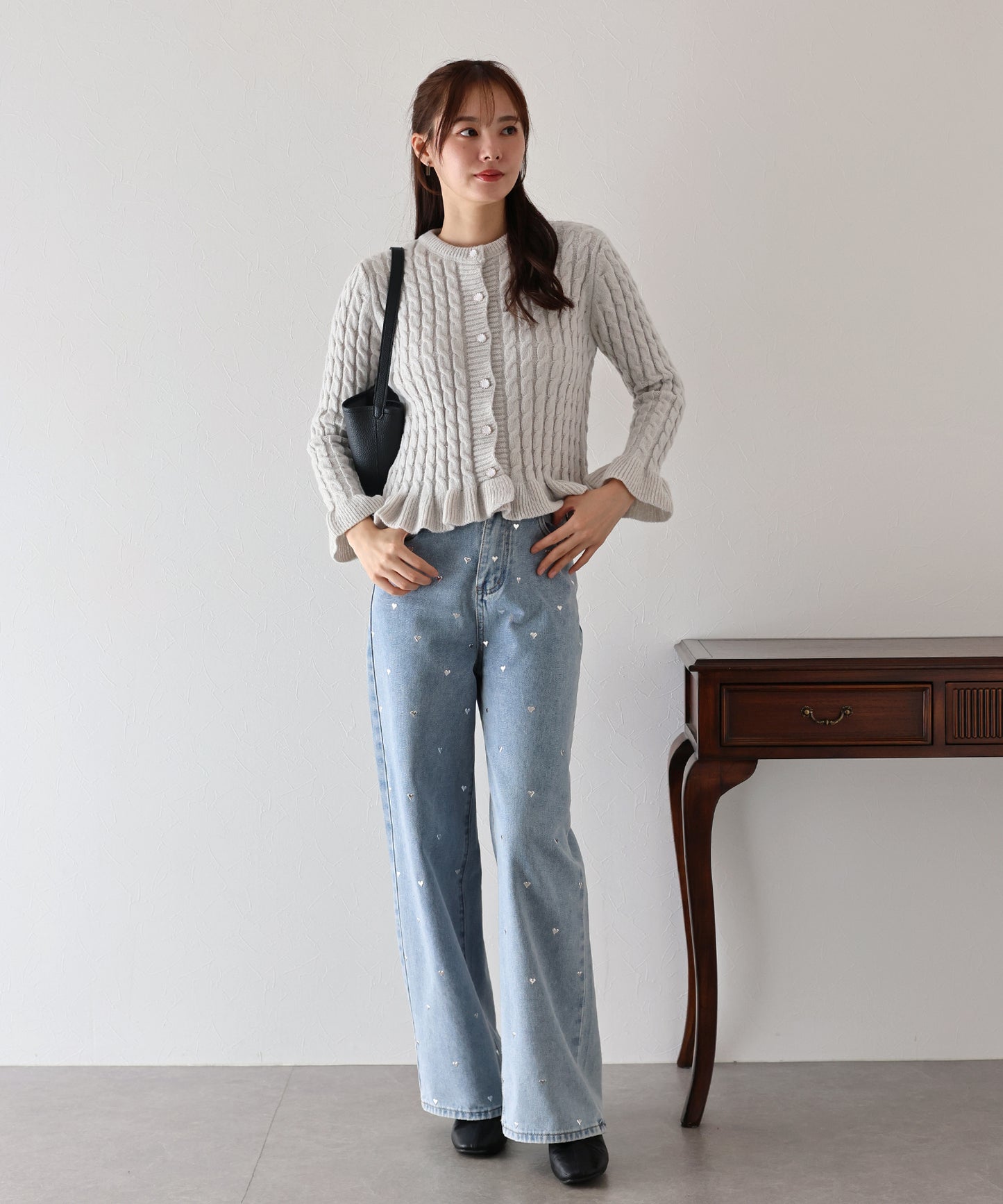 ケーブルペプラムカーディガン