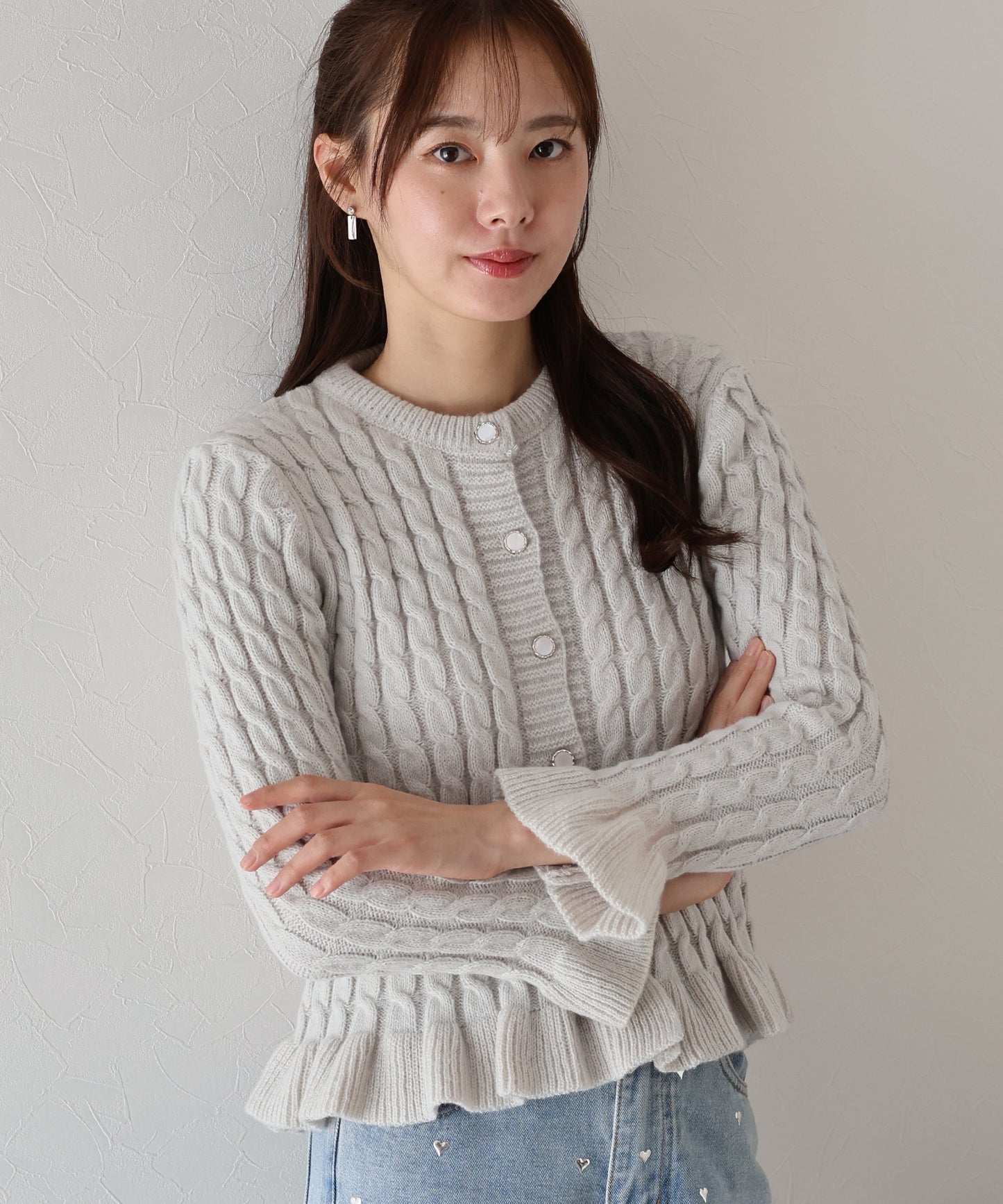 ケーブルペプラムカーディガン
