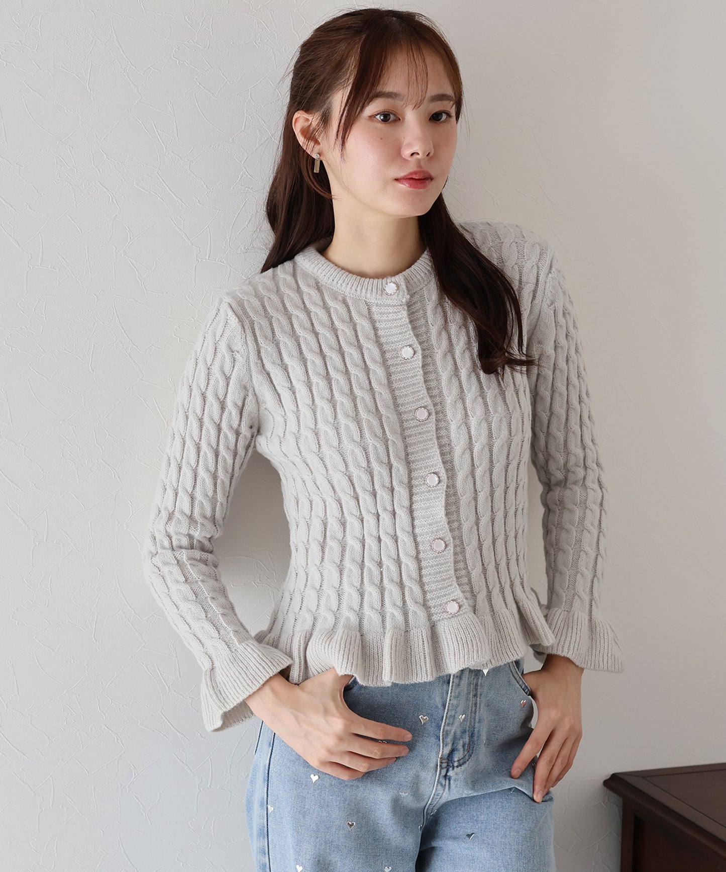 ケーブルペプラムカーディガン