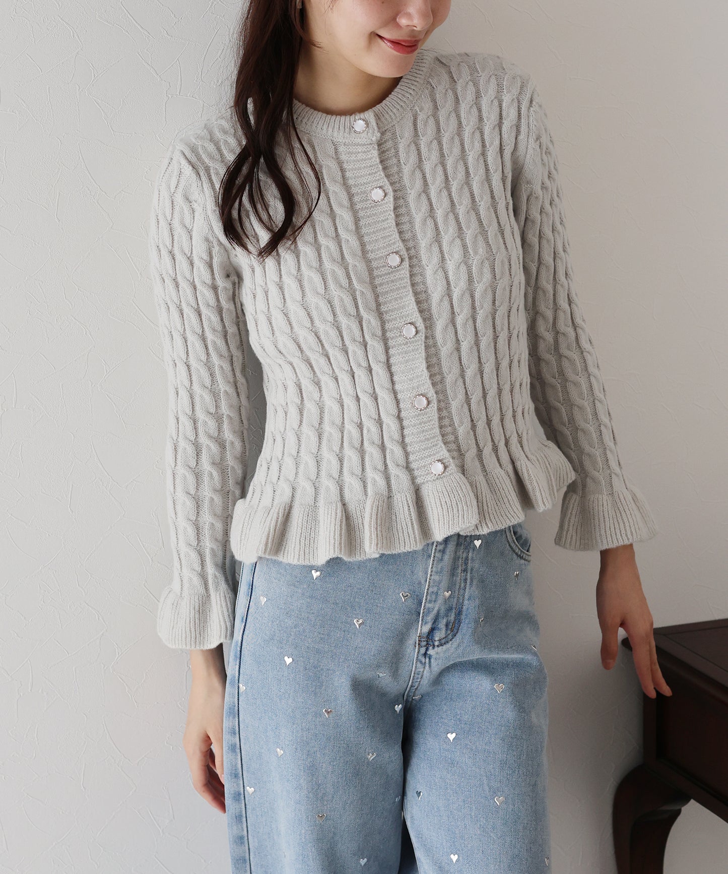 ケーブルペプラムカーディガン
