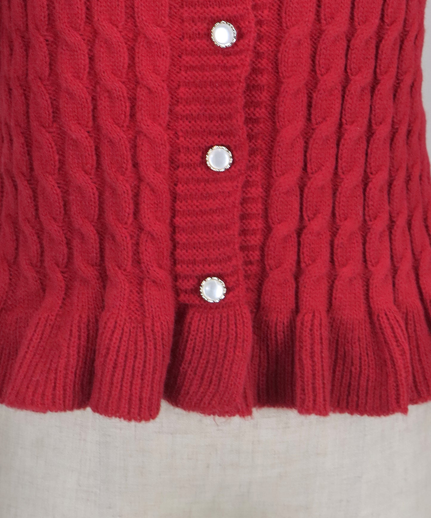 ケーブルペプラムカーディガン